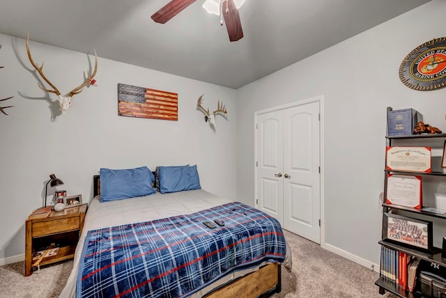 8430 E County Rd 114, Midland, TX 79706 - carpeted bedroom with baseboards and a ceiling fan