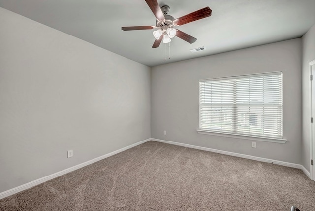 8430 E County Rd 114, Midland, TX 79706 - spare room with light colored carpet, baseboards, and ceiling fan
