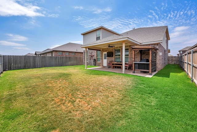 8430 E County Rd 114, Midland, TX 79706 - back of property with brick siding, a ceiling fan, a patio area, and a shingled roof