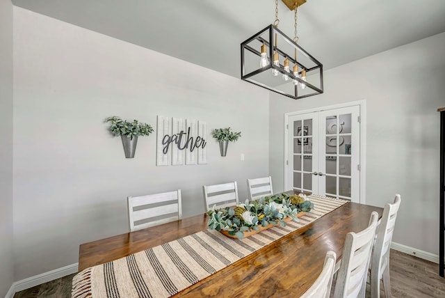 8430 E County Rd 114, Midland, TX 79706 - dining room with french doors, a chandelier, baseboards, and wood finished floors