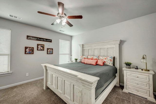 8430 E County Rd 114, Midland, TX 79706 - carpeted bedroom with baseboards and a ceiling fan