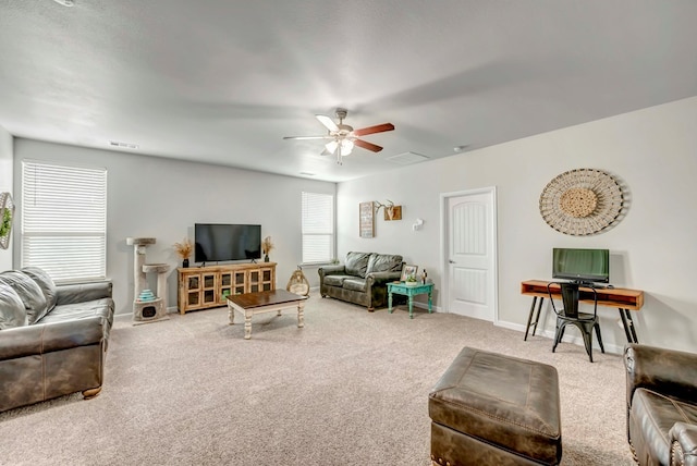 8430 E County Rd 114, Midland, TX 79706 - carpeted living room featuring a ceiling fan and baseboards