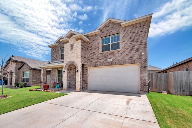 8430 E County Rd 114, Midland, TX 79706 - view of front facade with brick siding, concrete driveway, and an attached garage