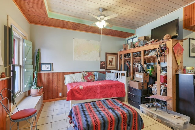 106 SE 4th St, Marathon, TX 79842 - bedroom with wooden ceiling, tile patterned flooring, a wainscoted wall, and wooden walls
