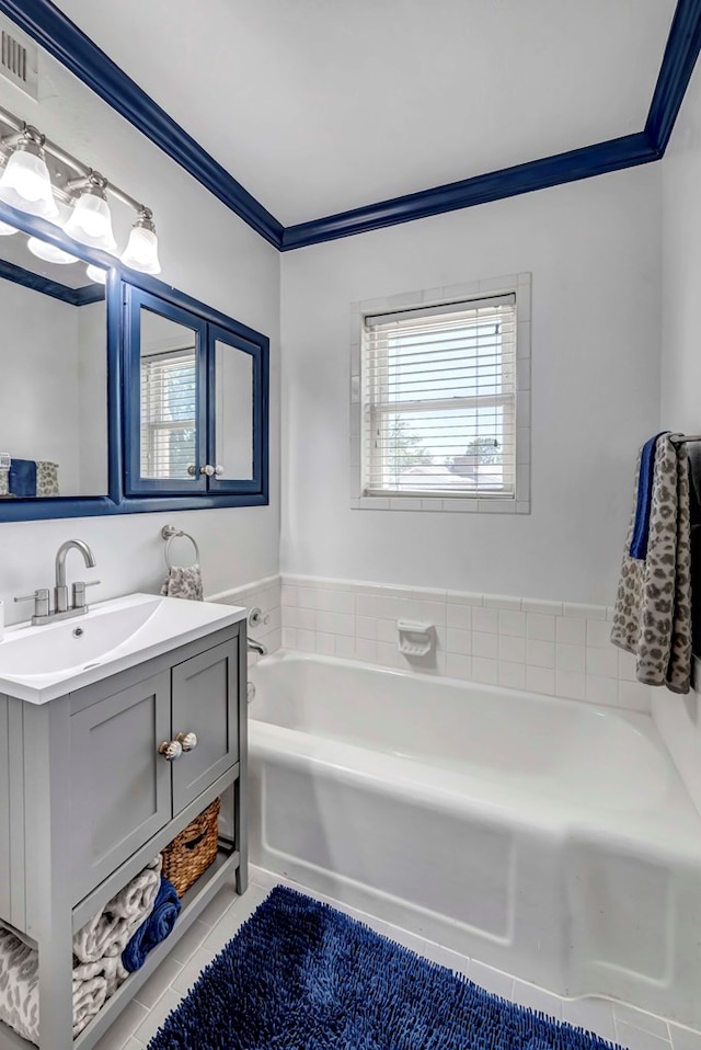 1600 W Kansas Ave, Midland, TX 79701 - full bath featuring vanity, a bath, tile patterned floors, and crown molding