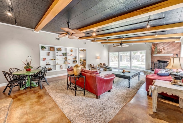 1600 W Kansas Ave, Midland, TX 79701 - living room featuring ceiling fan, concrete flooring, beamed ceiling, and a fireplace