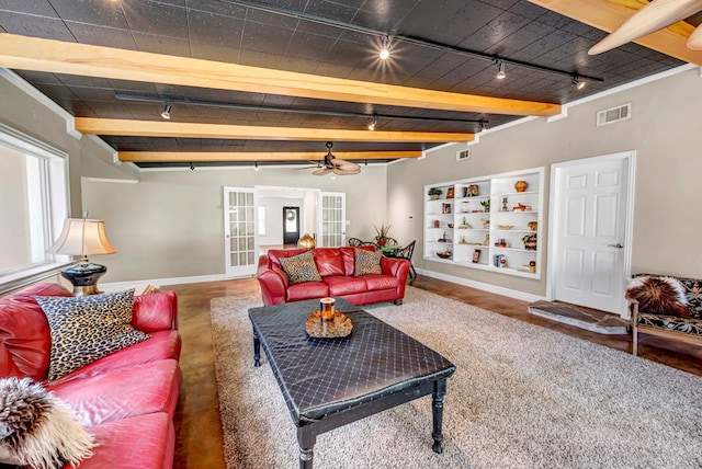 1600 W Kansas Ave, Midland, TX 79701 - living room with track lighting, ceiling fan, and beamed ceiling
