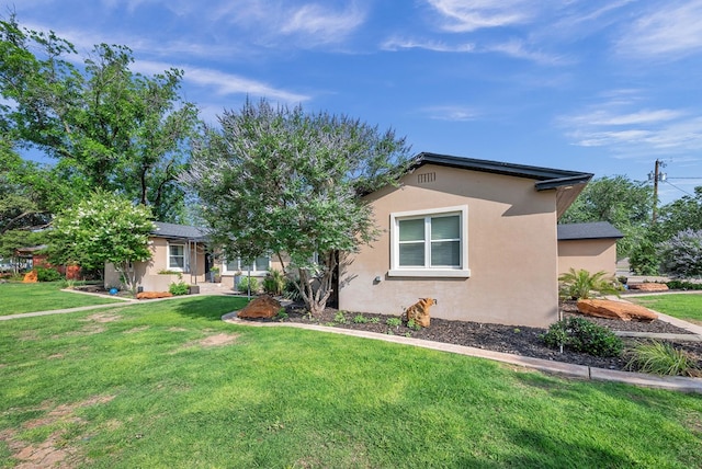 1600 W Kansas Ave, Midland, TX 79701 - view of front of property featuring stucco siding and a front yard