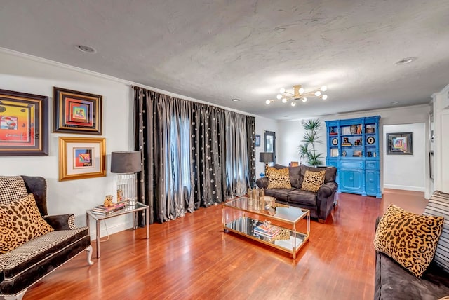 1600 W Kansas Ave, Midland, TX 79701 - living area with wood finished floors, crown molding, a chandelier, and recessed lighting