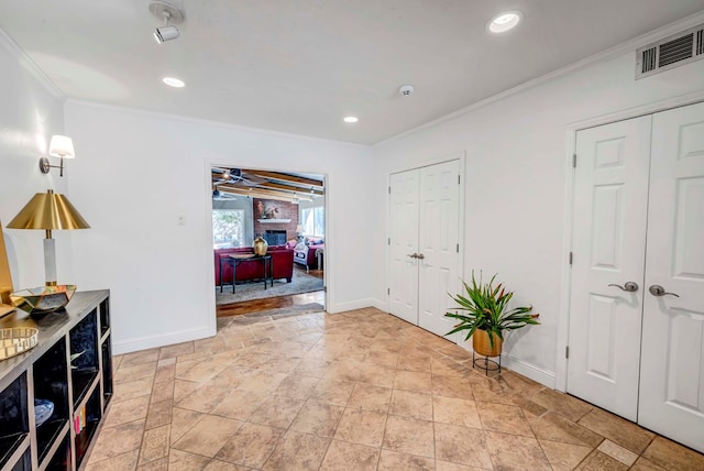 1600 W Kansas Ave, Midland, TX 79701 - entrance foyer with ornamental molding, recessed lighting, and light stone finish floors