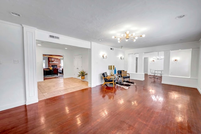 1600 W Kansas Ave, Midland, TX 79701 - living room featuring a chandelier and wood finished floors