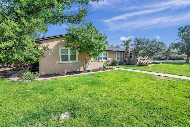 1600 W Kansas Ave, Midland, TX 79701 - view of front of property featuring stucco siding and a front lawn