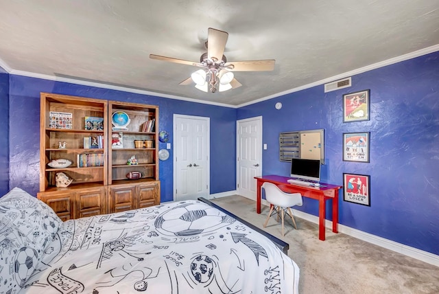 1600 W Kansas Ave, Midland, TX 79701 - carpeted bedroom with ornamental molding, a ceiling fan, and a desk