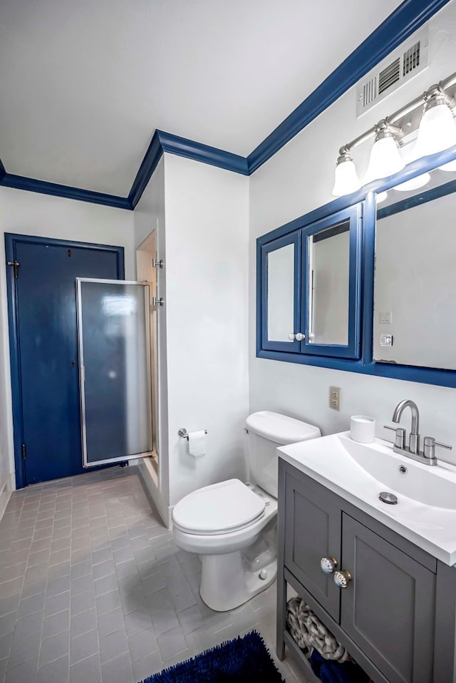 1600 W Kansas Ave, Midland, TX 79701 - bathroom with ornamental molding, vanity, tile patterned floors, and a stall shower
