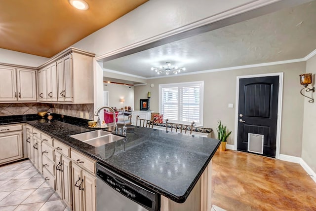 1600 W Kansas Ave, Midland, TX 79701 - kitchen with dishwasher, a peninsula, a chandelier, tasteful backsplash, and ornamental molding