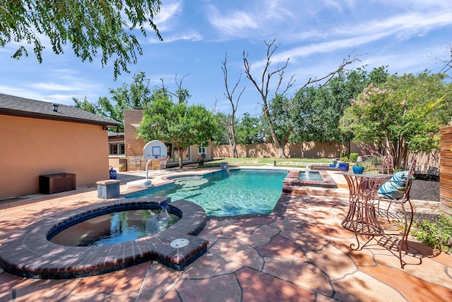 1600 W Kansas Ave, Midland, TX 79701 - view of pool with a pool with connected hot tub, a storage unit, a patio area, and a fenced backyard