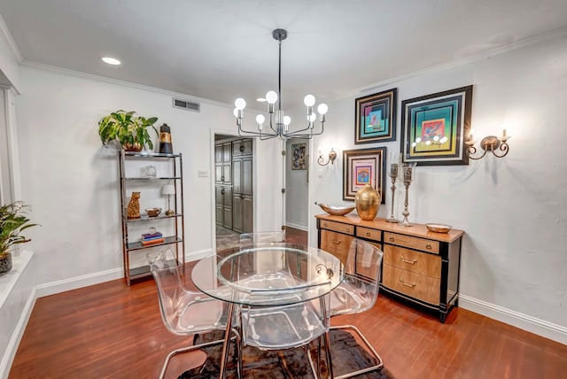 1600 W Kansas Ave, Midland, TX 79701 - dining area with dark wood-style floors, a chandelier, crown molding, and recessed lighting