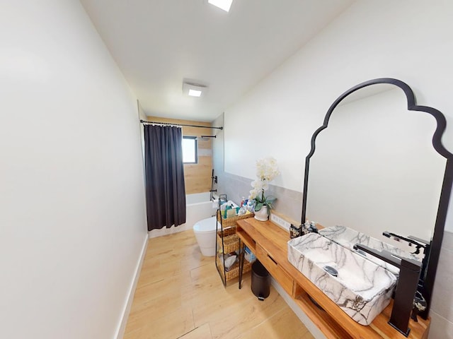 1411 NE Mustang Dr, Andrews, TX 79714 - corridor featuring wood finished floors and baseboards