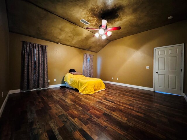 8801 N Rice Ave, Odessa, TX 79765 - bedroom featuring wood finished floors, vaulted ceiling, baseboards, and ceiling fan