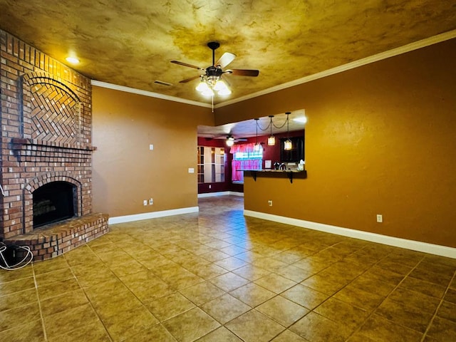 8801 N Rice Ave, Odessa, TX 79765 - unfurnished living room featuring a ceiling fan, tile patterned floors, a brick fireplace, ornamental molding, and baseboards