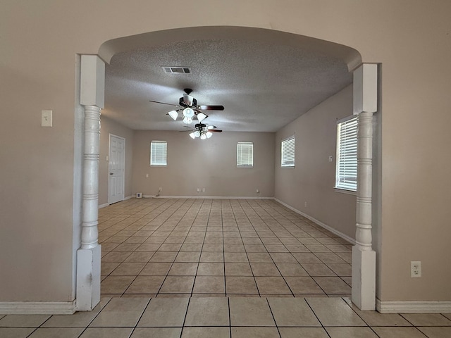 615 Placer Ave, Odessa, TX 79763 - spare room with ceiling fan, light tile patterned floors, a textured ceiling, and baseboards