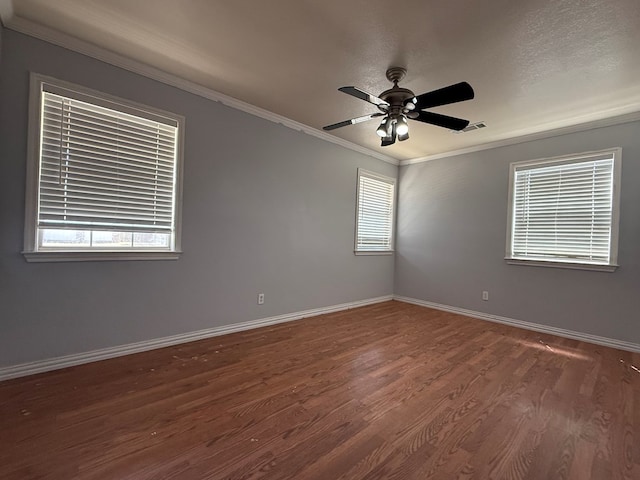 615 Placer Ave, Odessa, TX 79763 - spare room featuring ornamental molding, wood finished floors, baseboards, and a ceiling fan