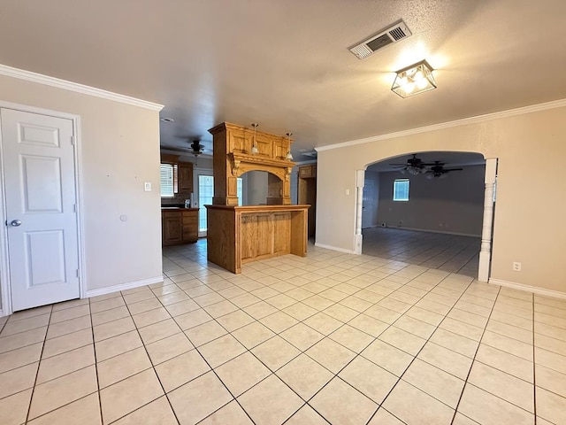 615 Placer Ave, Odessa, TX 79763 - kitchen featuring ceiling fan, light tile patterned flooring, ornamental molding, baseboards, and open floor plan