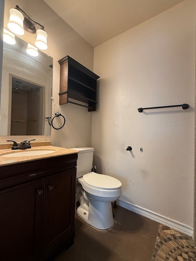 615 Placer Ave, Odessa, TX 79763 - bathroom featuring vanity, toilet, baseboards, and tile patterned floors