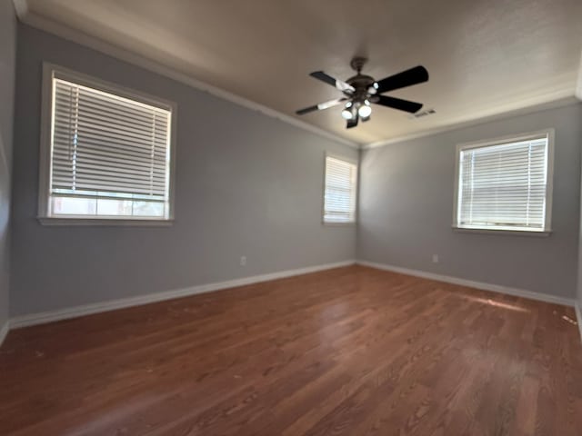 615 Placer Ave, Odessa, TX 79763 - spare room with wood finished floors, ornamental molding, baseboards, and a ceiling fan