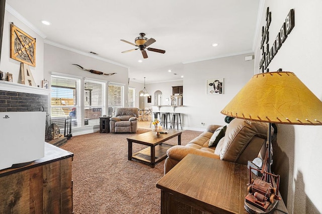 carpeted living room with recessed lighting, ornamental molding, and a ceiling fan