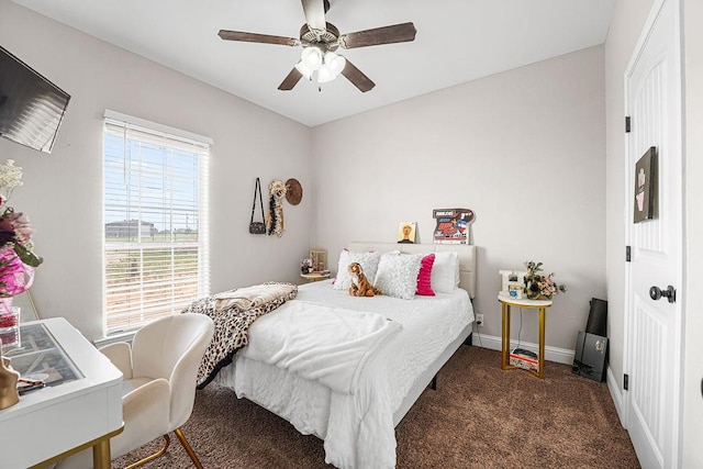 carpeted bedroom with a ceiling fan and baseboards