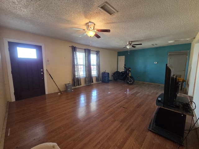 3301 N Jackson Ave, Odessa, TX 79762 - foyer featuring wood finished floors, a textured ceiling, and a ceiling fan