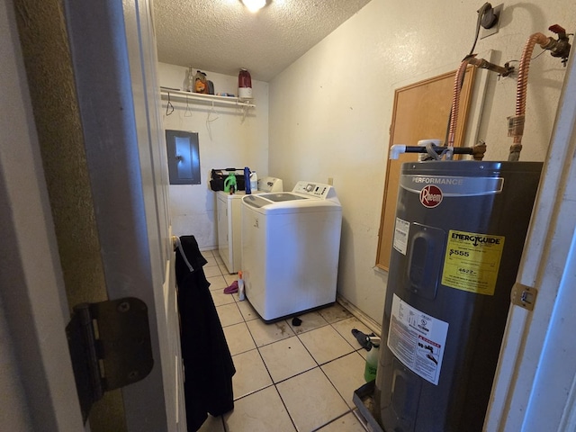 3301 N Jackson Ave, Odessa, TX 79762 - laundry area with washer and dryer, electric water heater, a textured ceiling, electric panel, and light tile patterned flooring