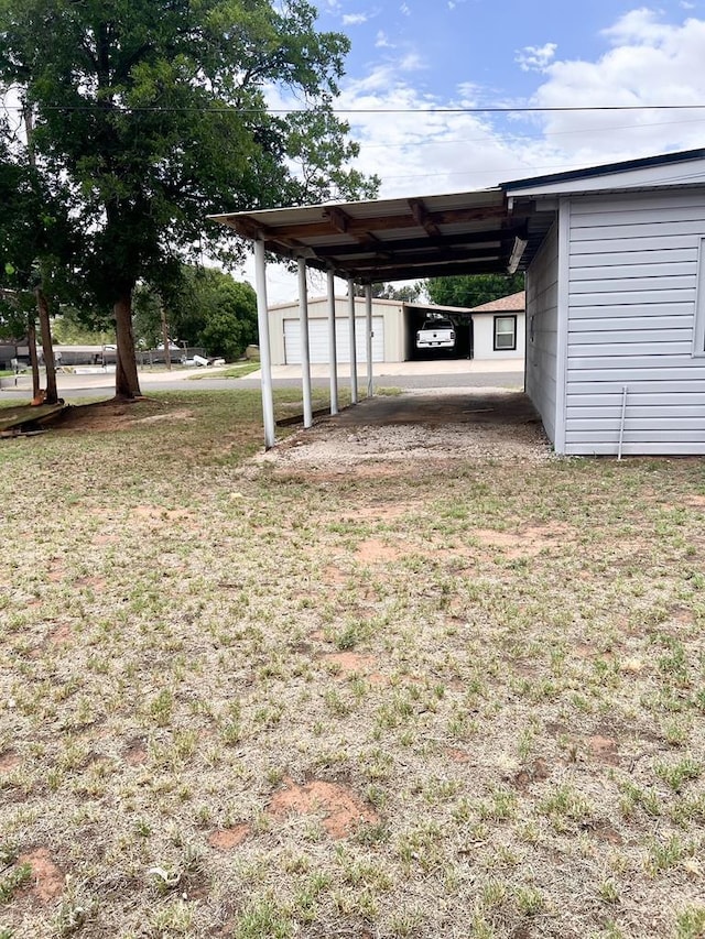 1100 NW 7th St, Andrews, TX 79714 - view of parking / parking lot with an attached carport