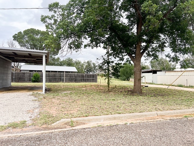 1100 NW 7th St, Andrews, TX 79714 - view of yard featuring a carport