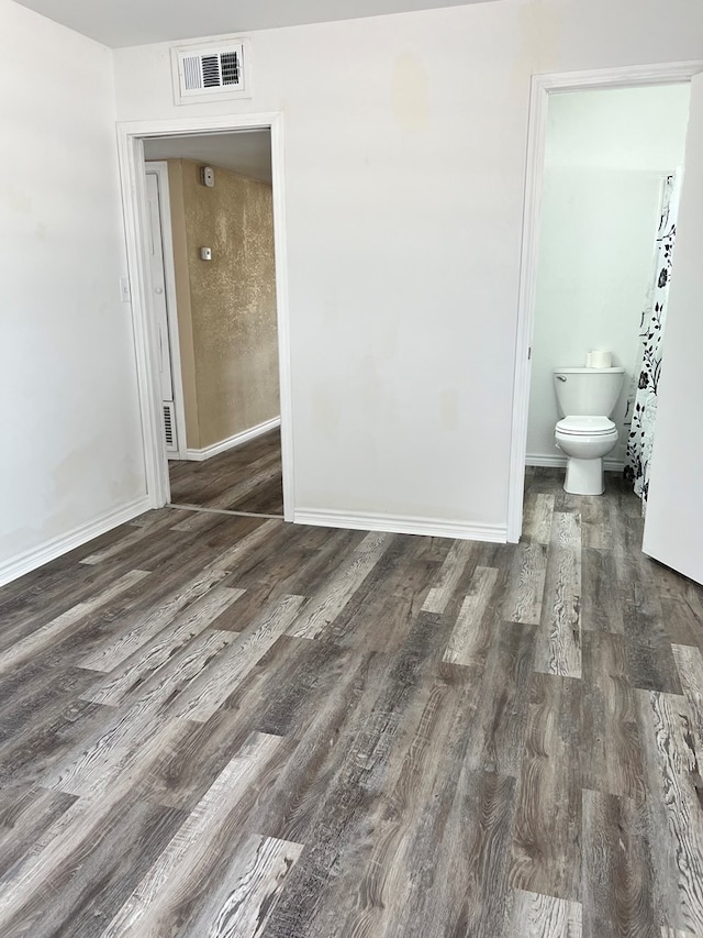 1100 NW 7th St, Andrews, TX 79714 - unfurnished room with wood finished floors and baseboards