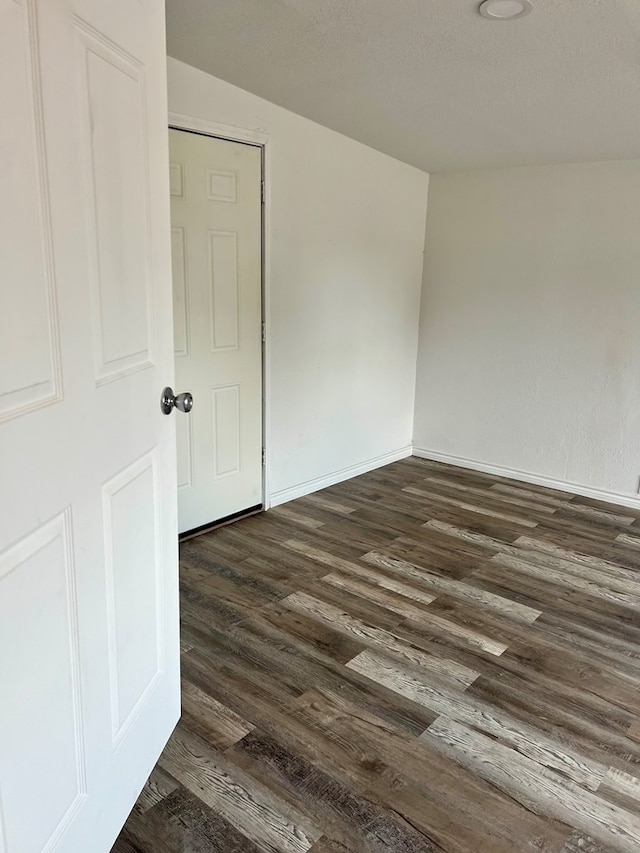 1100 NW 7th St, Andrews, TX 79714 - empty room with dark wood-type flooring