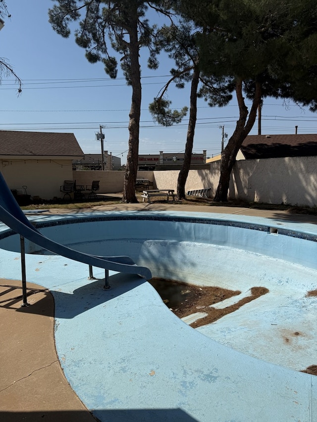 4235 Candy Ln, Odessa, TX 79762 - view of pool featuring a water slide and a fenced backyard