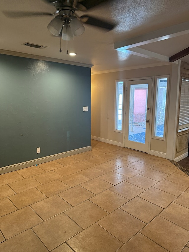 4235 Candy Ln, Odessa, TX 79762 - spare room featuring a ceiling fan, ornamental molding, and light tile patterned floors