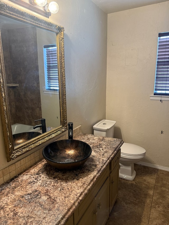 4235 Candy Ln, Odessa, TX 79762 - bathroom with vanity, tile patterned flooring, and a bath