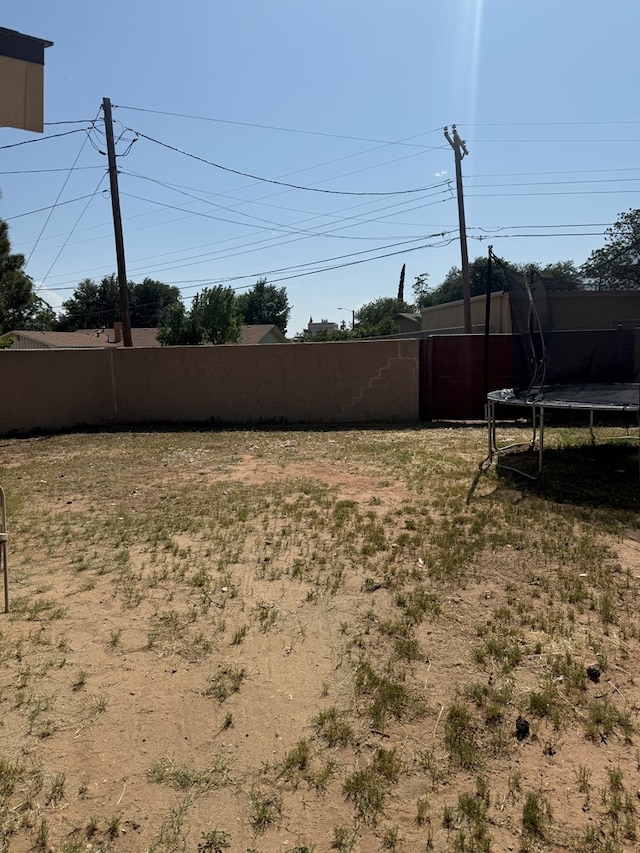 4235 Candy Ln, Odessa, TX 79762 - view of yard with a trampoline
