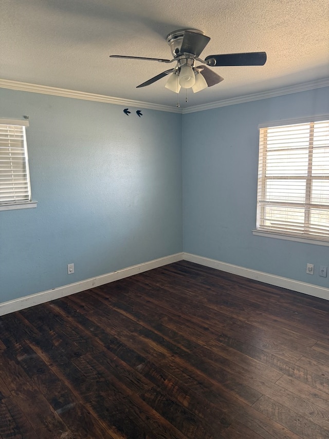 4235 Candy Ln, Odessa, TX 79762 - spare room featuring dark wood-type flooring, ornamental molding, ceiling fan, and a textured ceiling