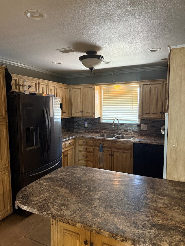 4235 Candy Ln, Odessa, TX 79762 - kitchen featuring black appliances, dark countertops, dark tile patterned flooring, ornamental molding, and decorative backsplash