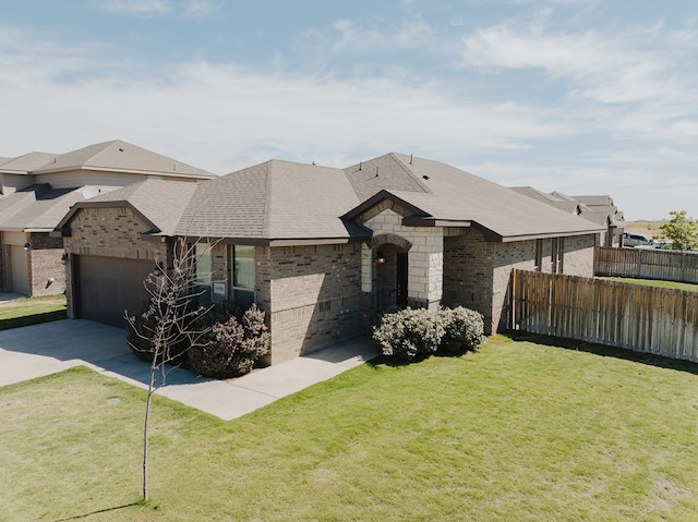 view of front facade featuring driveway, brick siding, and fence