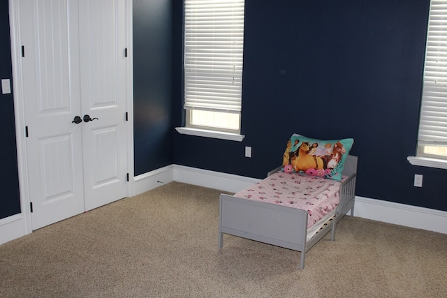 173 W 87th St, Odessa, TX 79764 - carpeted bedroom featuring multiple windows and a closet