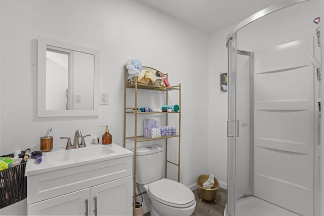 1758 N Fortune 500 Dr, Odessa, TX 79764 - bathroom featuring vanity, toilet, wood finished floors, and a shower stall