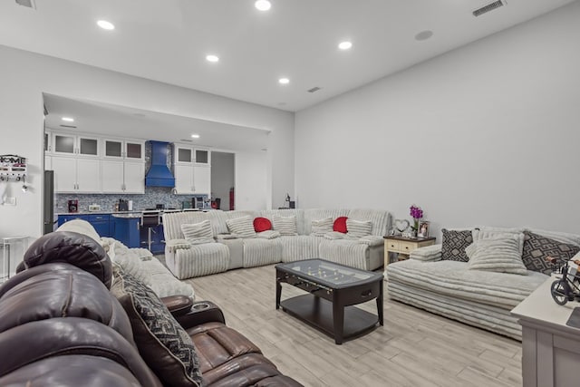 1758 N Fortune 500 Dr, Odessa, TX 79764 - living room featuring light wood-style floors, visible vents, and recessed lighting