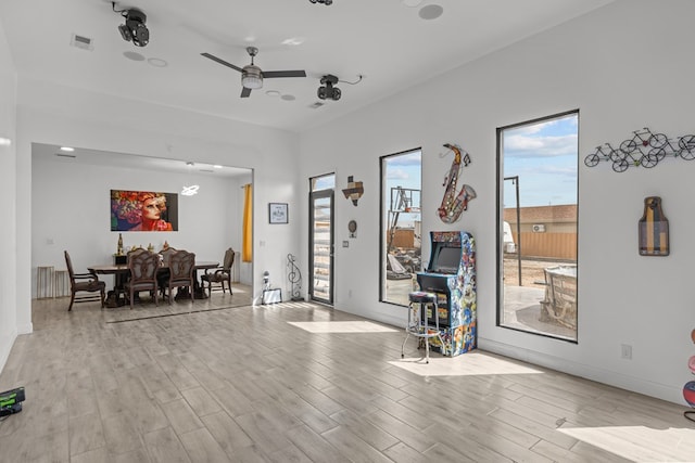1758 N Fortune 500 Dr, Odessa, TX 79764 - interior space featuring baseboards, ceiling fan, visible vents, and wood finished floors