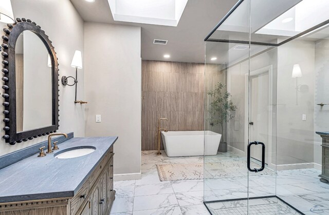 bathroom with a freestanding tub, visible vents, marble finish floor, a stall shower, and vanity