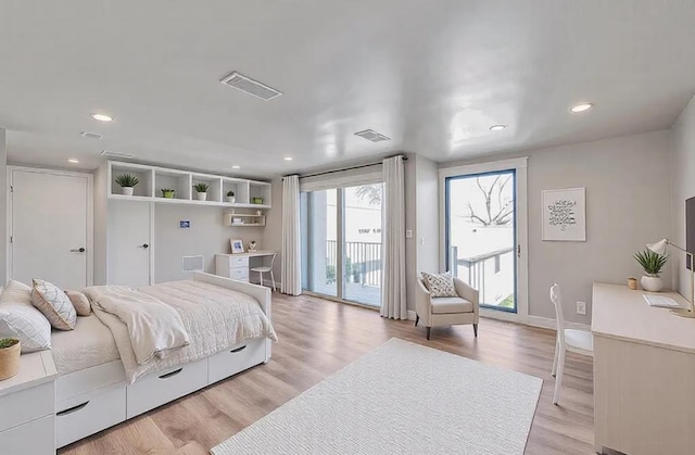 bedroom with recessed lighting, visible vents, light wood-style floors, and access to outside